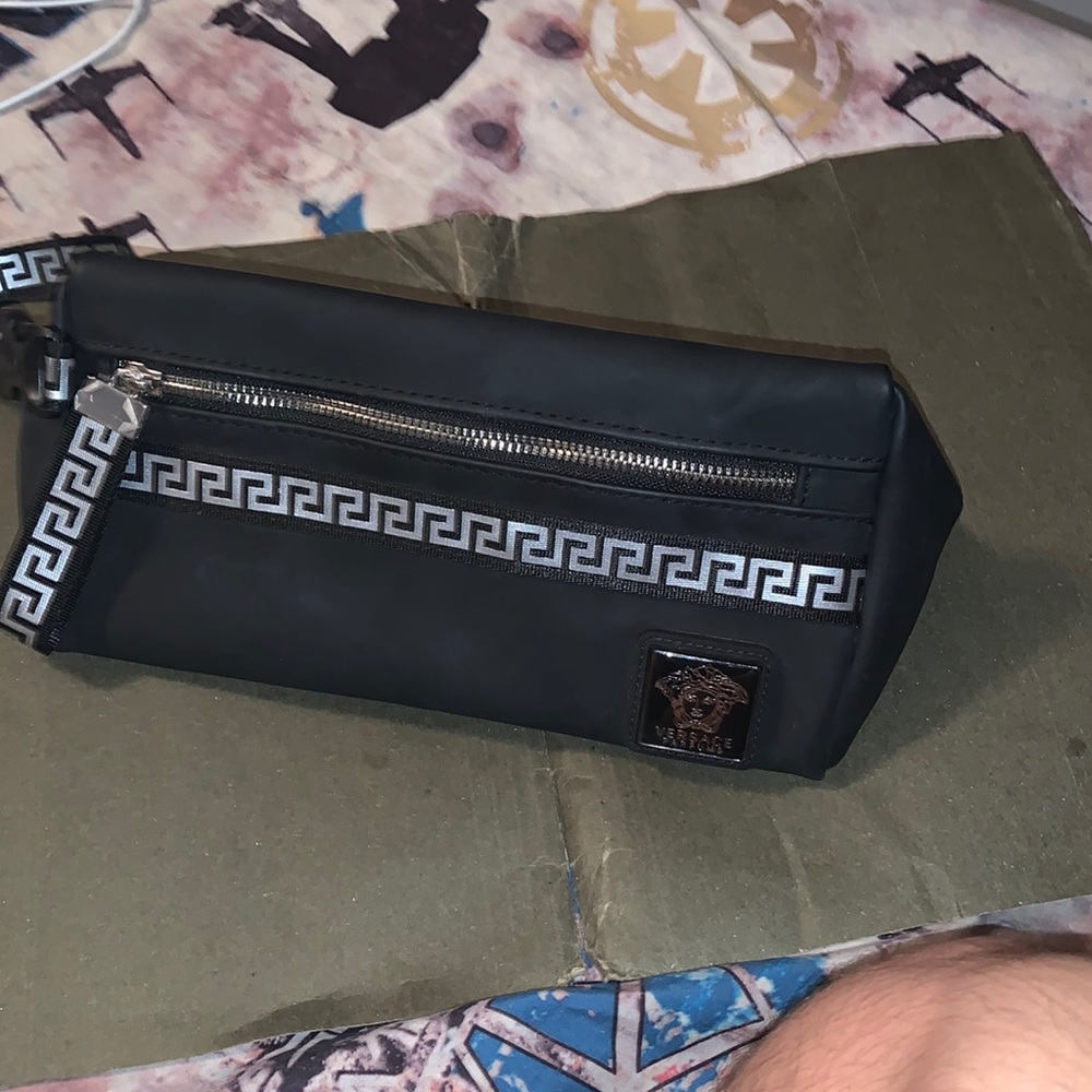 Versace bag good for storing items such as makeup, cologne, perfume etc.